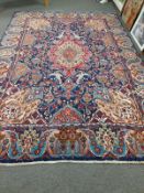 A Persian carpet on indigo ground,