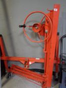 A portable board and plaster board hoist on casters