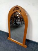 A continental oak ecclesiastical style arch topped mirror