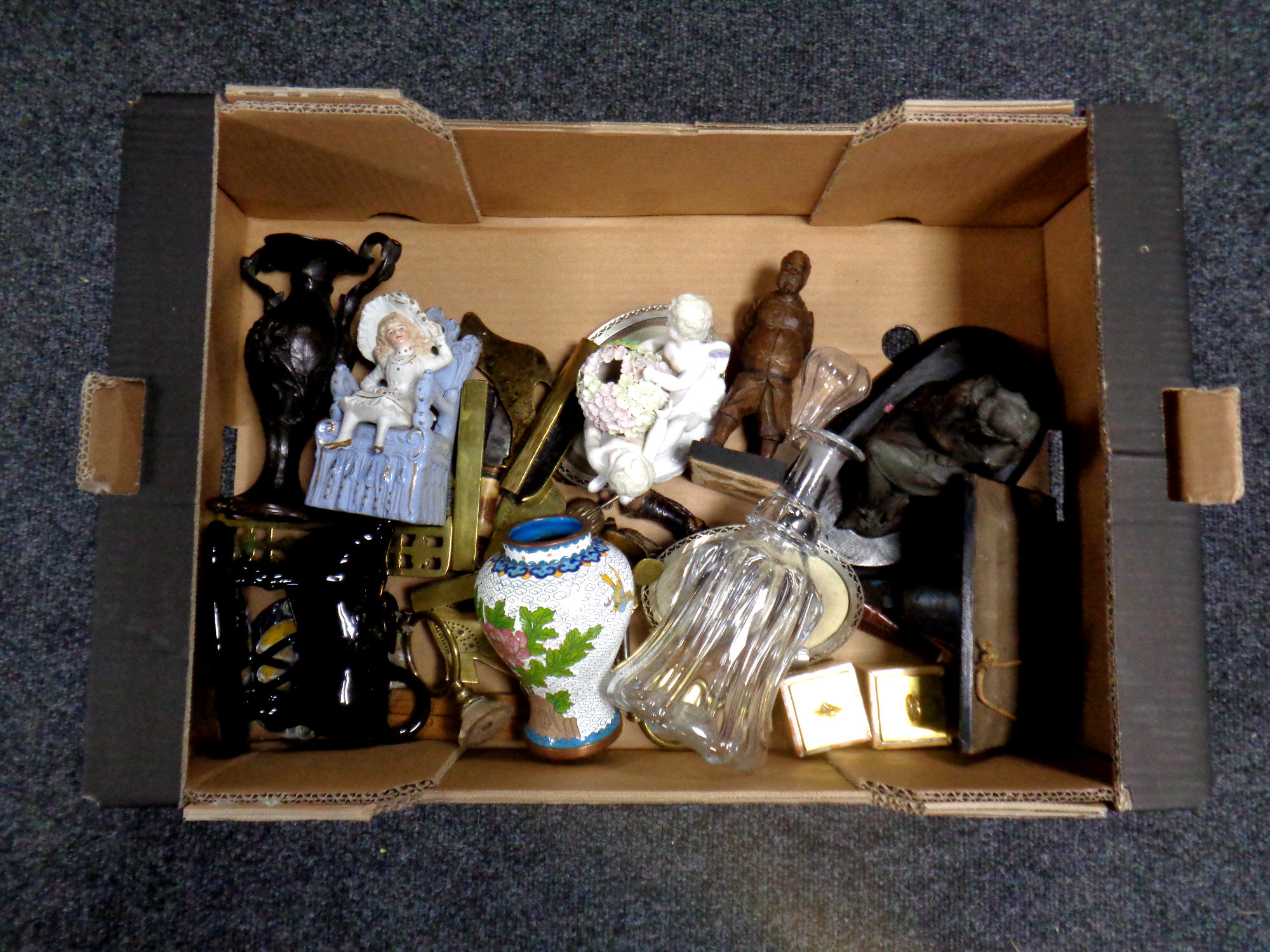 A box containing miscellaneous to include antique glass decanter, continental figures,