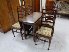 A good quality oak gate leg table together with a set of four ladder back chairs