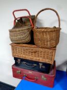 A 20th century wicker picnic basket together with four further wicker hand baskets and two 20th