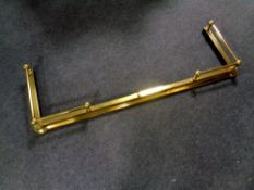 A brass telescopic fire curb