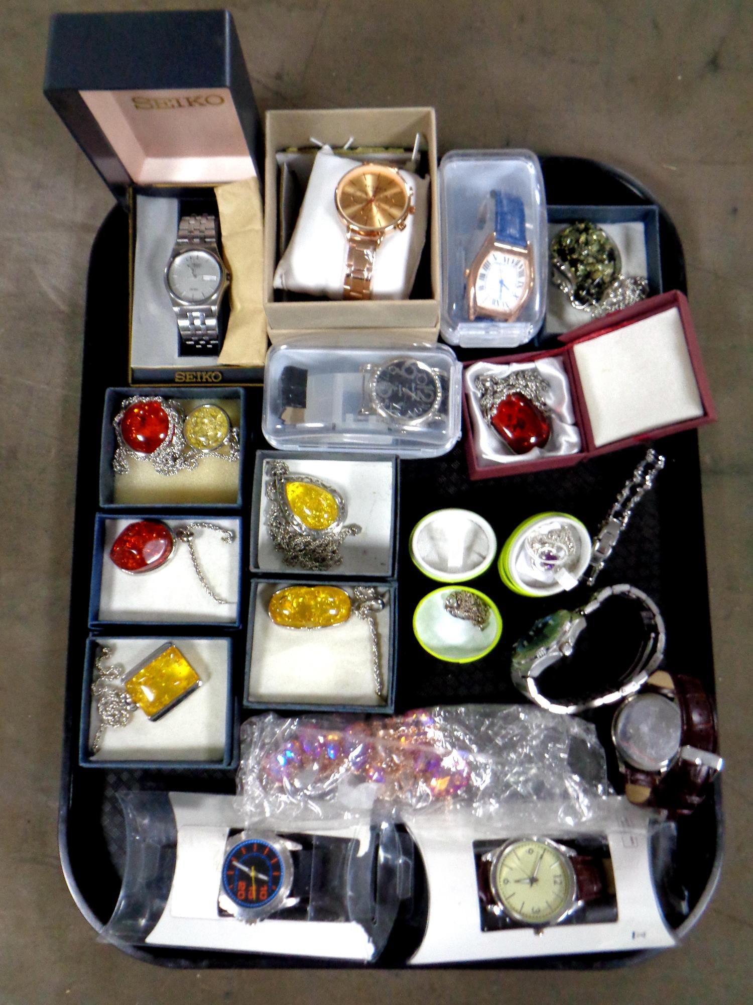 A tray containing assorted costume jewellery and assorted gent's wristwatches,