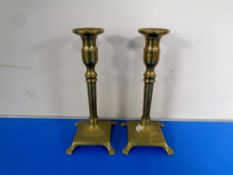 A pair of brass candlesticks