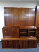 A mid 20th century Danish rosewood modular unit with cupboards, bureau, bookcase and shelves,