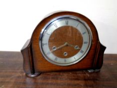 A 20th century oak cased Smiths mantel clock with pendulum and key