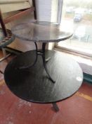 A circular marble topped occasional table on metal pedestal together with similar coffee table