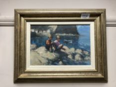 Richard W Marshall : Two children sitting on rocks by the sea, oil on panel, signed, 19 x 27 cm,