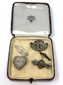 Five antique silver brooches.