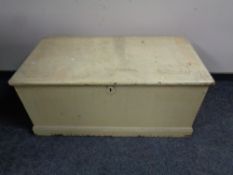 An antique painted pine blanket box