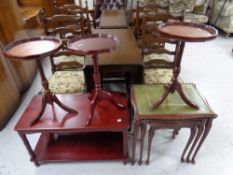 A nest of three glass and leather topped tables together with a two tier coffee tale and three wine
