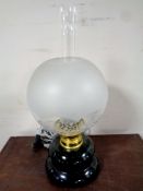 A Holmegaard oil lamp on green glass base,