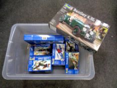 A plastic storage crate with lid containing Revell modelling kits : military air craft and a