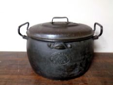 A Clark and Company cast iron lidded cooking pot