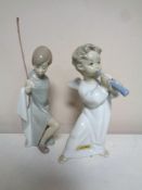 A Lladro figure, Cherub with flute, together with a further Lladro figure,