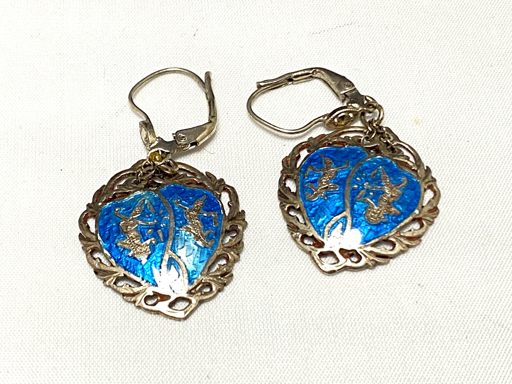 A pair of silver and enamel earrings