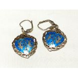 A pair of silver and enamel earrings