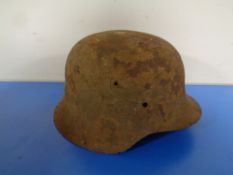 A German tin helmet (as found)