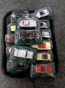 A tray containing 14 die cast classic cars in plastic bubbles