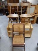 A pair of pine folding kitchen chairs together with a further bergere folding kitchen chair and two