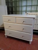 A contemporary four drawer chest (white)