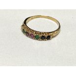 A 9ct gold ring with coloured gemstones, spelling the word 'Dearest', size R, 1.