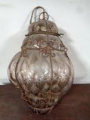 An early 20th century bubbled glass and wire pendant light fitting