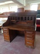 A late 19th century oak roll top desk (as found), width 152 cm,