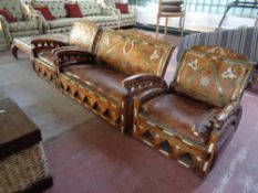 A four piece Moroccan pine inlaid lounge suite comprising of two seater settee,