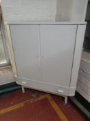 A 20th century Danish teak double door corner cabinet fitted a drawer (painted)