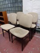 A set of four mid 20th century stained beech dining chairs
