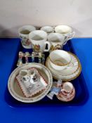 A tray containing antique and later ceramics to include a Minton gold rose china trio,