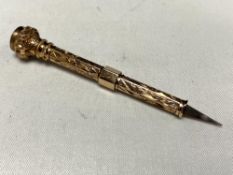 A vintage 9ct gold tooth pick