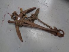 A cast iron anchor on chain