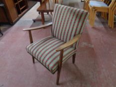 A mid 20th century armchair upholstered in a heart tapestry fabric