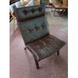 A late 20th century Scandinavian brown button leather and beech lounge chair