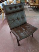 A late 20th century Scandinavian brown button leather and beech lounge chair