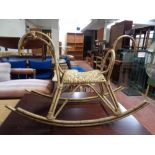 A bamboo and wicker rocking horse