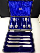 A boxed set of silver plated Apostle spoons and a part set of butter knives