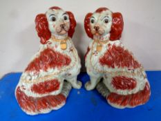 A pair of Staffordshire spaniel figures