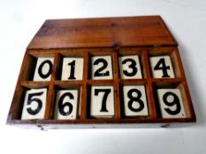 An early 20th century pine church box containing hymn board numbers