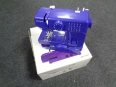 A John Lewis sewing machine, purple,