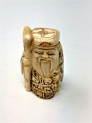 A carved Chinese bone netsuke,