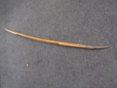 An antique rustic twin bladed tool
