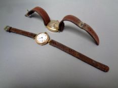 Two 9ct gold wristwatches on leather straps