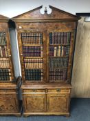 A reproduction burr elm double door bookcase fitted slide,