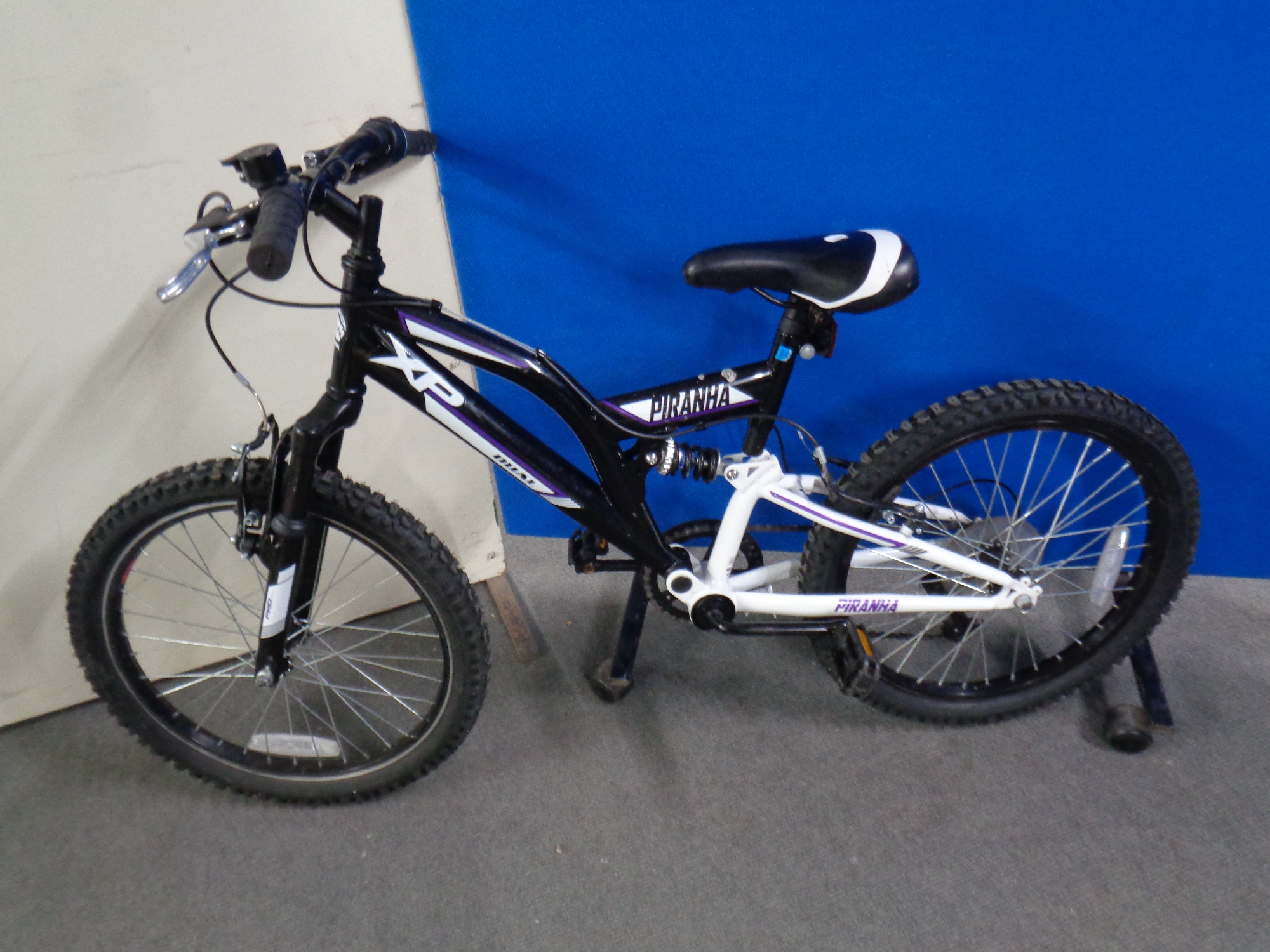 A Piranha XP Dual full suspension child's mountain bike