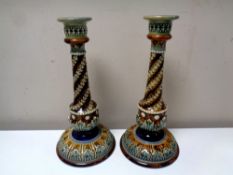 A near pair of Royal Doulton candlesticks, height 29.8 and 29.