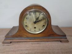 A 20th century oak cased Westminster chime mantel clock with silvered dial